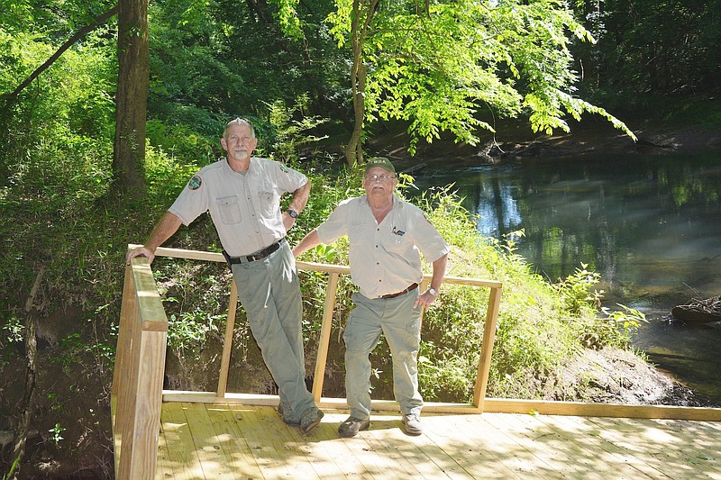 WMA manager Greg Atchley stands on one of the new ramps at the North Chickamauga Creek canoe launch alongside technician Fred Majors.