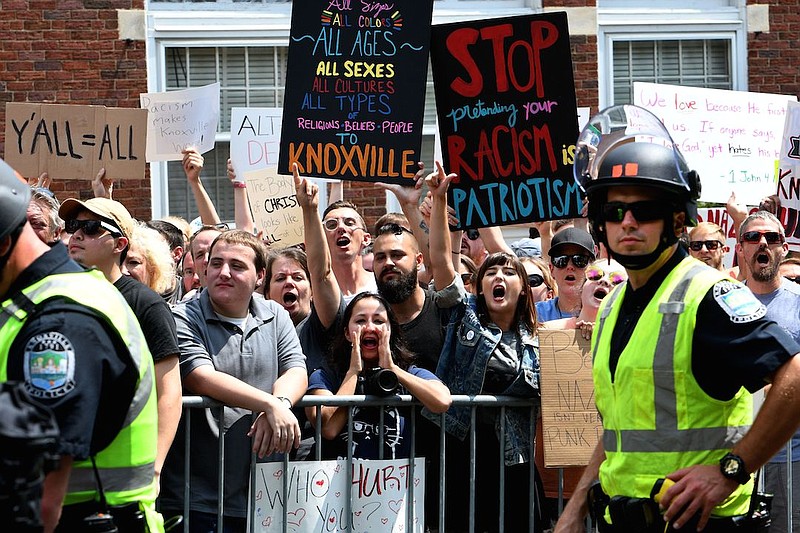 Counterprotestors scream at protestors across the street during a rally that ended peacefully in Fort Sanders on Saturday, Aug. 26, in Knoxville.
 (Michael Patrick/News Sentinel)