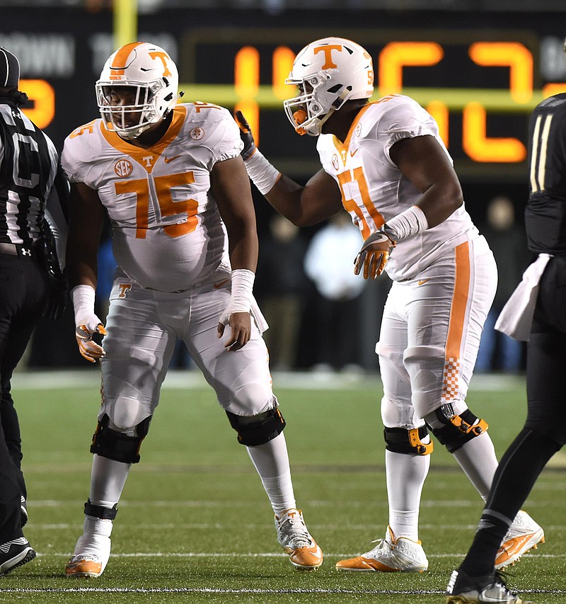 Tennessee offensive tackle Drew Richmond, right, talks with Jashon Robertson during last season's game at Vanderbilt. Richmond has been suspended by the team for the season opener.