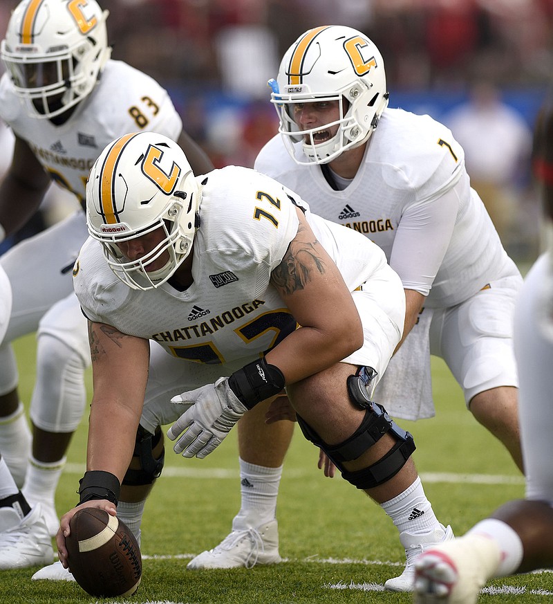 UTC quarterback Nick Tiano calls signals behind center Josh Cardiello during this past Saturday's season-opening loss to Jacksonville State in Montgomery, Ala.