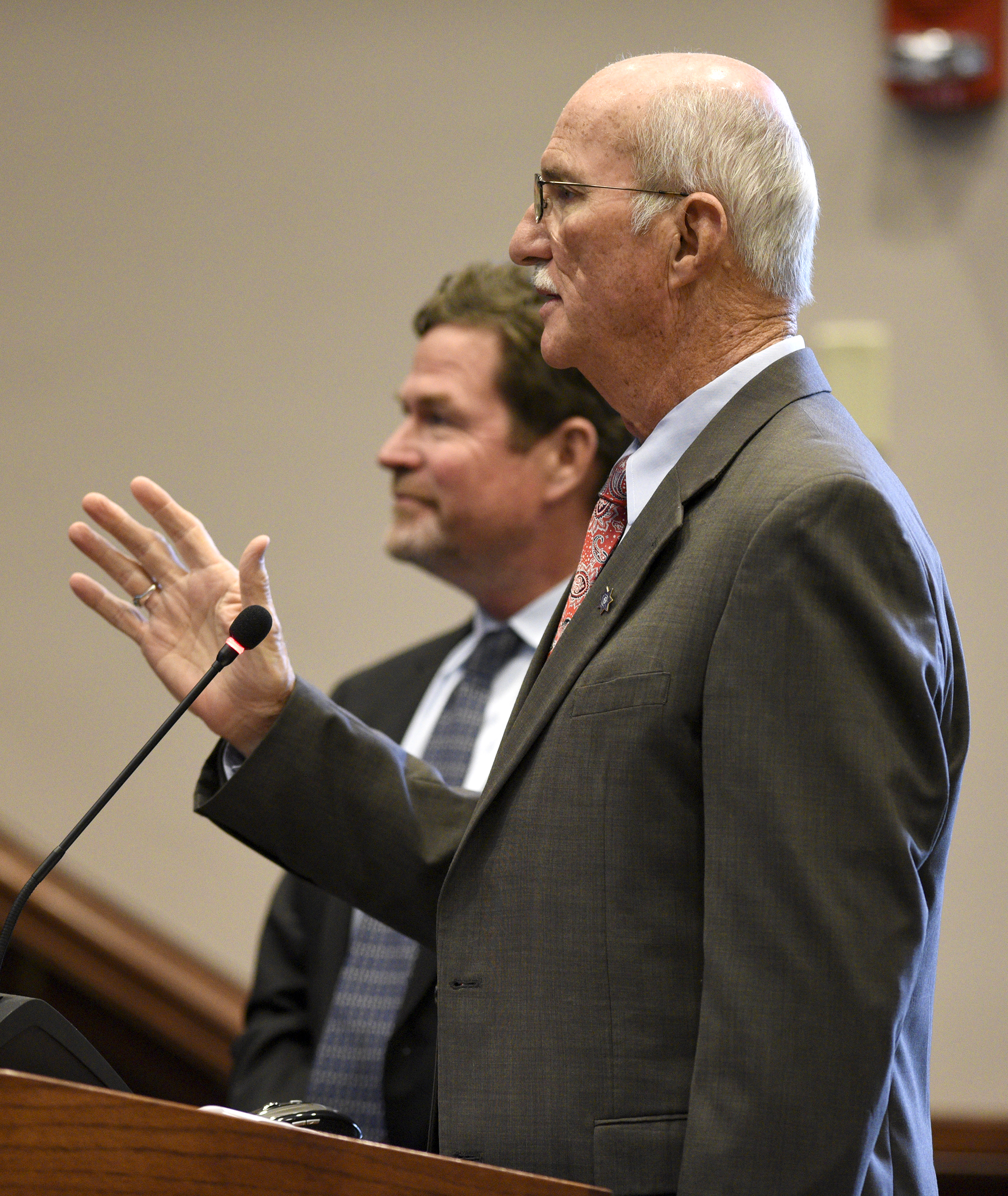 Hamilton County Sheriff Jim Hammond answers questions from the commission. Listening in the background is Tom Morsch Managing Director of PFM Financial Advisors LLC. The Hamilton County Commission listened to a presentation and recommendations for short and long-term jail and workhouse overcrowding at the Wednesday meeting in the Hamilton County Courthouse on August 29, 2017.