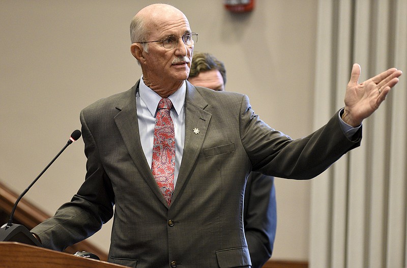 Hamilton County Sheriff Jim Hammond answers questions from the commission.  Listening in the background is Tom Morsch Managing Director of PFM Financial Advisors LLC.  The Hamilton County Commission listened to a presentation and recommendations for short and long-term jail and workhouse overcrowding at the Wednesday meeting in the Hamilton County Courthouse on August 29, 2017. 