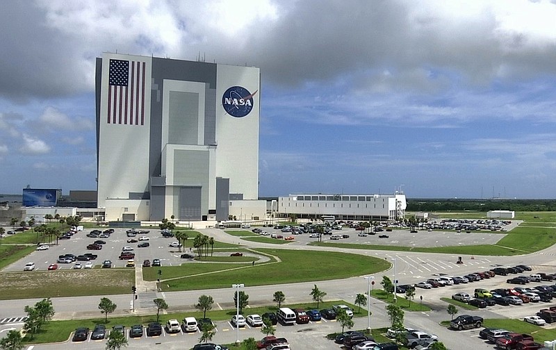 
              This July 14, 2017, photo shows the Vehicle Assembly Building at NASAs Kennedy Space Center in Cape Canaveral, Florida in Cape Canaveral, Fla. NASA says it may soon have the capability to send astronauts to the International Space Station from U.S. soil for the first time since the retirement of the space shuttle in 2011. (AP Photo/Alex Sanz)
            