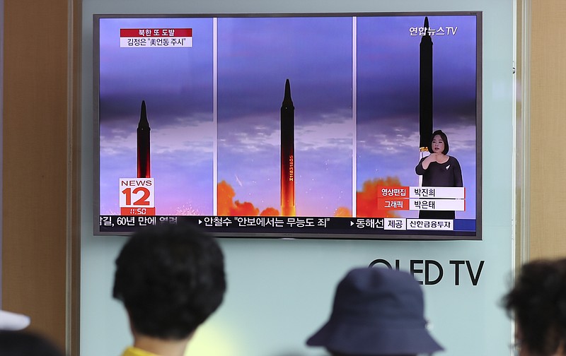 
              People watch a TV screen showing a local news program reporting about North Korea's missile launch at Seoul Train Station in Seoul, South Korea, Wednesday, Aug. 30, 2017. North Korean leader Kim Jong Un called for more weapons launches targeting the Pacific Ocean to advance his country's ability to contain Guam, state media said Wednesday, a day after Pyongyang for the first time flew a ballistic missile designed to carry a nuclear payload over Japan. (AP Photo/Lee Jin-man)
            