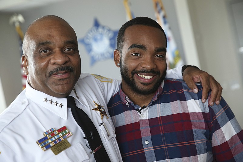 
              In this Monday, Aug. 28, 2017 photo, Chicago police Superintendent Eddie Johnson, left, and his son Daniel Johnson pose for a photo in Superintendent Johnson's office at Chicago Police Department headquarters. Daniel Johnson is donating a kidney to his father. (Chris Walker/Chicago Tribune via AP)
            