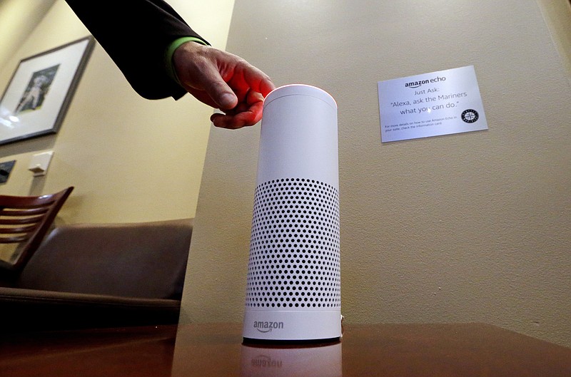 
              FILE - In this May 17, 2017, file photo, an Amazon Alexa device is switched on for a demonstration of its use in a ballpark suite before a Seattle Mariners baseball game in Seattle. Microsoft and Amazon are making their Alexa and Cortana voice assistants team up and talk to each other in a new collaboration. Both companies say that later in fall 2017, users will be able to access Alexa using Cortana on Windows 10 computers and on Android and Apple devices. They’ll also be able to access Cortana on Alexa-enabled devices such as the Amazon Echo. (AP Photo/Elaine Thompson, File)
            