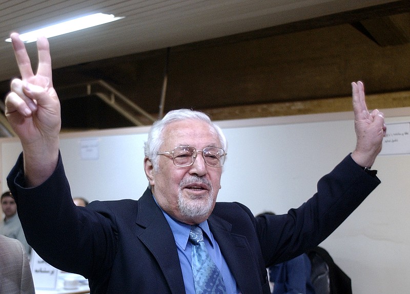 
              FILE - In this May 14, 2005 file photo, Ebrahim Yazdi, once Iran's Foreign Minister, flashes the victory sign, as he arrives at the Interior Ministry, to register as a presidential candidate, in Tehran, Iran. Iran's official IRNA news agency says one of the country's most influential dissident politicians who once served as foreign minister, Ebrahim Yazdi, has died. He was 85. The report of Monday, Aug. 28, 2017, says Yazdi died in Izmir, Turkey, due to complications from cancer.  (AP Photo/Vahid Salemi, File)
            