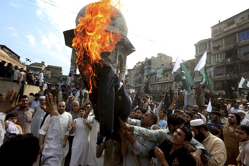 
              Pakistani protesters burn an effigy of U.S. President Donald Trump in Peshawar, Pakistan, Thursday, Aug. 31, 2017. Protesters objected to Trump's allegation that Islamabad is harboring militants who battle U.S. forces in Afghanistan. (AP Photo/Muhammad Sajjad)
            