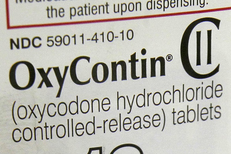 
              FILE - This Feb. 19, 2013, file photo, shows a portion of the label for OxyContin pills in Montpelier, Vt. On Thursday, Aug. 31, 2017, safety advocates and state health officials filed a petition calling on the U.S. Food and Drug Administration to ban high-dose opioid painkillers to prevent accidental overdose deaths among patients and people who abuse drugs. The petition singles out the OxyContin 80 milligram tablet, which is taken twice daily, adding up to 240 morphine-equivalent milligrams. It seeks a ban on other high-dose opioid tablets and under-the-tongue films. (AP Photo/Toby Talbot, File)
            