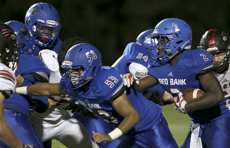 Red Bank's Zay Brown (2) follows the blocking of teammate Ashton Alderson (53) against Signal Mountain at Red Bank Community Stadium on Friday, Sept. 1, in Chattanooga, Tenn.