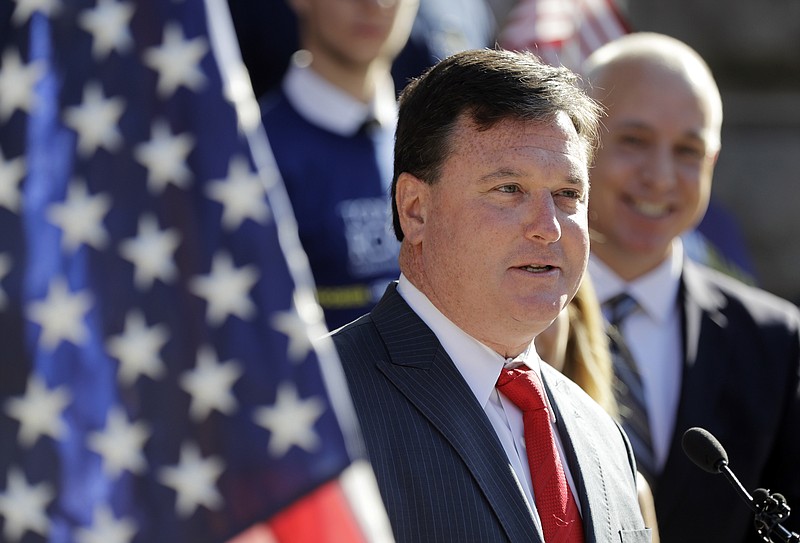 
              FILE- In this Aug. 9, 2017, file photo, Indiana Rep. Todd Rokita speaks during a news conference outside of the Indiana Statehouse in Indianapolis. Working for Rokita is an exacting job with long hours, made more difficult by a boss known for micromanaging and yelling at his staff, according to 10 former aides who spoke to The Associated Press. The lawmaker rejected the criticism and said he demands excellent from his staff and himself. (AP Photo/Darron Cummings, File)
            