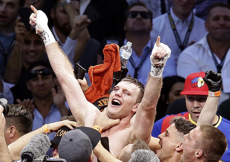 
              FILE - In this July 2, 2017, file photo, Jeff Horn, of Australia, celebrates after beating Manny Pacquiao, of the Philippines, in a WBO World Welterweight title fight in Brisbane, Australia.  Pacquiao won't box Horn in a rematch of their WBO world welterweight title fight this year because the Filipino senator will be busy with government duties. Pacquiao's unavailability for a proposed Nov. 12 bout was announced Friday, Sept. 1, 2017, by Australian promoters of the fight. (AP Photo/Tertius Pickard, File)
            