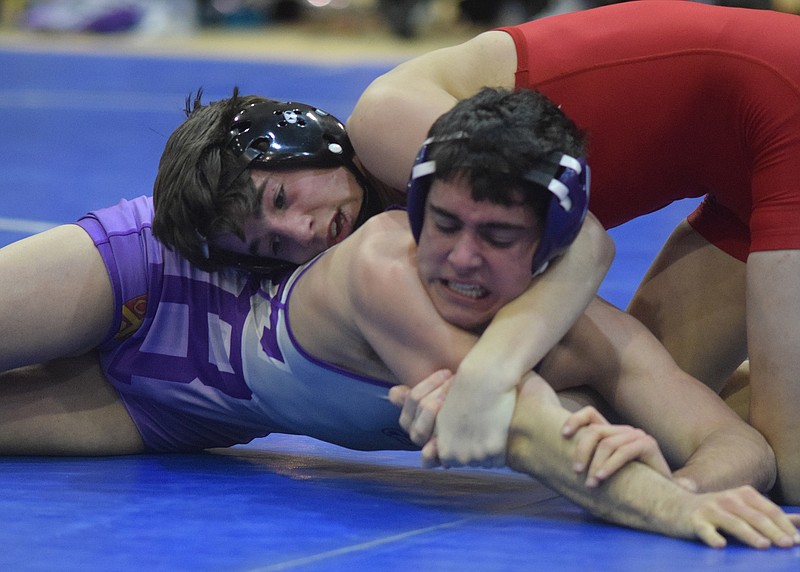 Baylor's Mason Reiniche, left, controls Father Ryan's Jared Frazier in the 126-pound class.  Reiniche won the match.  Montgomery Bell Academy, Father Ryan, Baylor and McCallie wrestled Friday night at the McCallie School