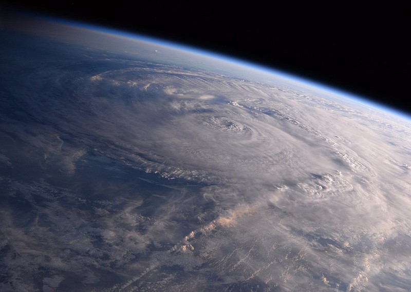 
              FILE - This photo made available by NASA shows Hurricane Harvey over Texas on Saturday, Aug. 26, 2017, seen from the International Space Station. Experts say a combination of unusual factors turned Harvey into a deadly monster. The storm intensified just before it hit land, parked itself over one unfortunate area and dumped a record amount of rain. (Randy Bresnik/NASA via AP)
            