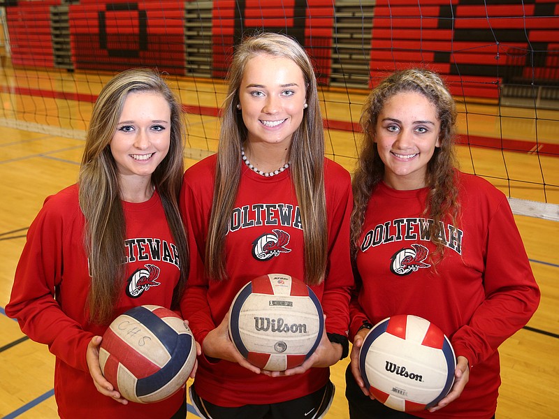 Ooltewah High School volleyball players Ally Chernak, Macy Milliken and Tyler Sullivan pose for a photo Friday, Sept. 1, 2017, at Ooltewah High School in Ooltewah, Tenn. Each is the last in their family to play volleyball at Ooltewah after they all had older siblings play ahead of them.