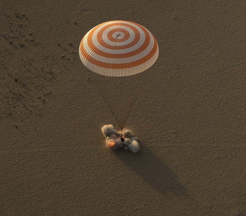 
              The Soyuz MS-04 spacecraft lands with Expedition 52 Commander Fyodor Yurchikhin of Roscosmos and Flight Engineers Peggy Whitson and Jack Fischer of NASA near the town of Zhezkazgan, Kazakhstan, Sunday, Sept. 3, 2017. Astronaut Whitson returned to Earth late Saturday (in the U.S.), wrapping up a record-breaking flight that catapulted her to first place for U.S. space endurance. (Bill Ingalls/NASA via AP)
            