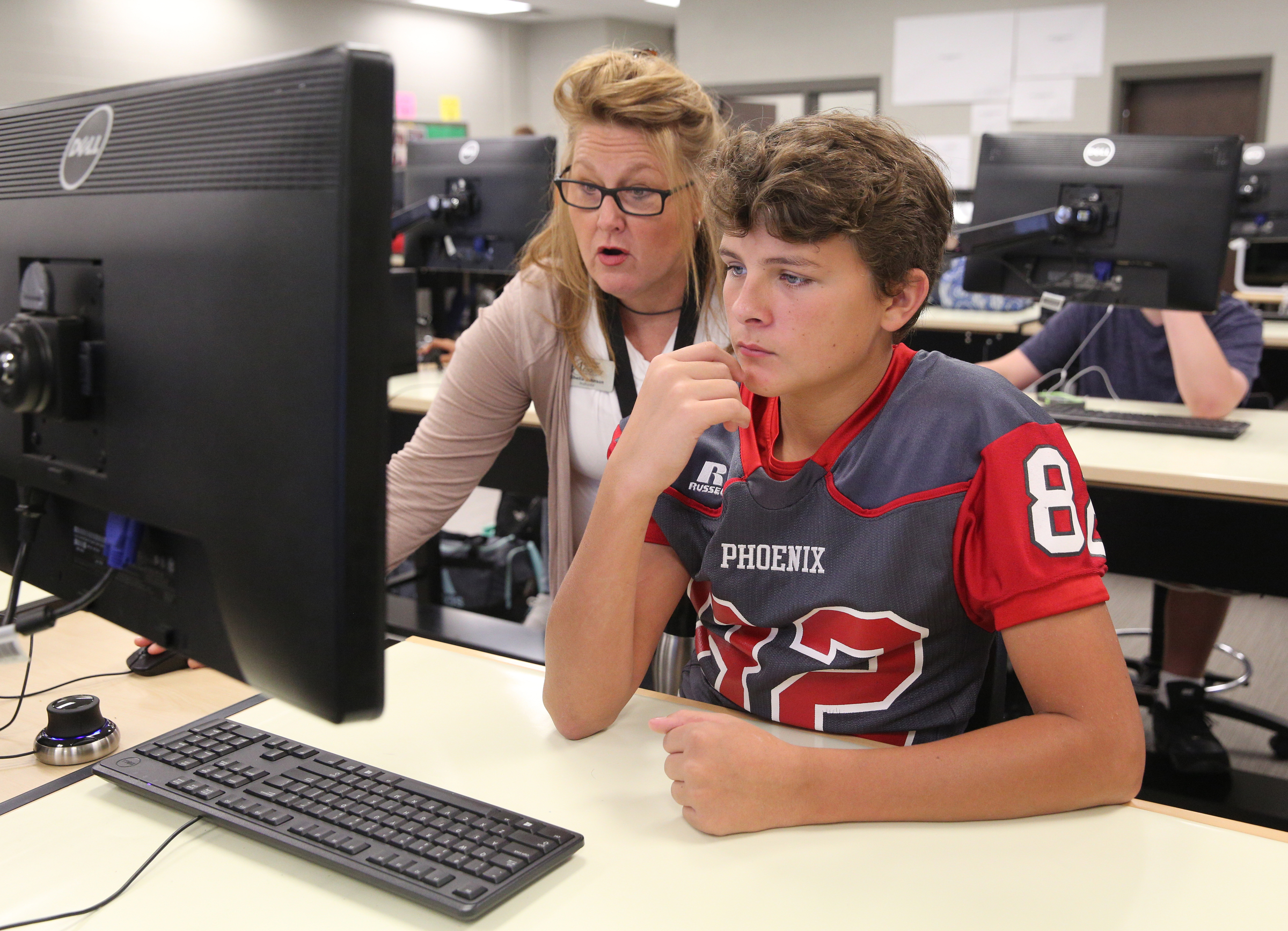 Engineering, drafting and design teacher Shelia Johnson works with Kevin Morrison, 14, in her class Friday, Sept. 1, 2017, at the Gordon County College and Career Academy in Calhoun, Ga. Students can take classes in graphic design, marketing, information technology as well as engineering, drafting and design through the career academy.