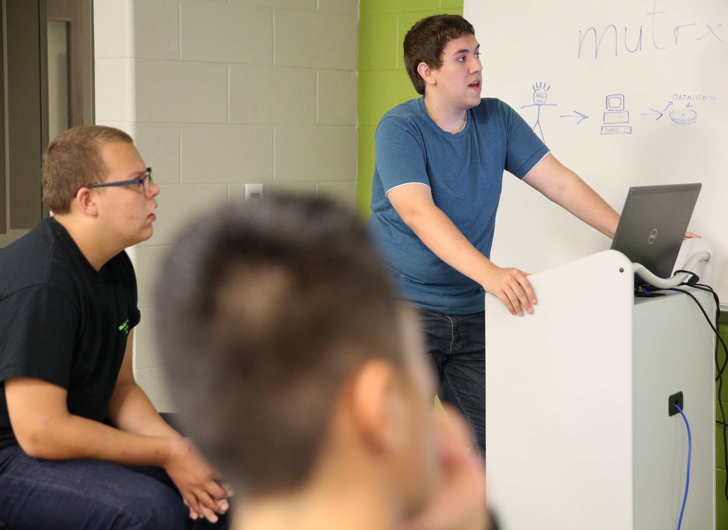 Jonathan Allison presents on coding languages to other Friday, Sept. 1, 2017, at the Gordon County College and Career Academy in Calhoun, Ga. Students can take classes in graphic design, marketing, information technology as well as engineering, drafting and design through the career academy.