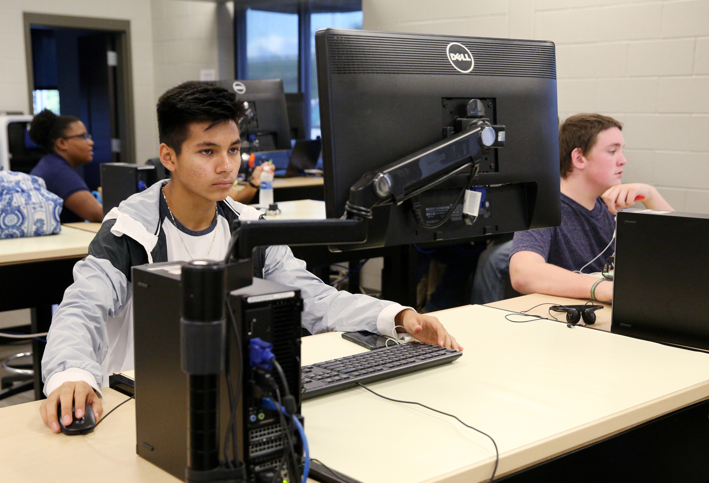 Alfredo Pegueros, 15, and Matthew Craig, 15, work on chains in a design program in their engineering, drafting and design class Friday, Sept. 1, 2017, at the Gordon County College and Career Academy in Calhoun, Ga. The career academy aims to prepare students to be both college and career ready.