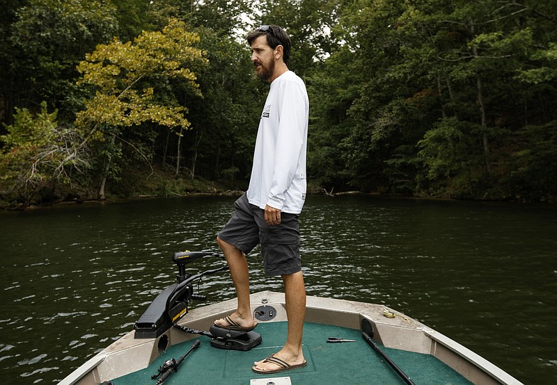 Chris Sumrell poses for a portrait on his fishing boat on Chickamauga Lake on Saturday, Sept. 2, 2017, in Chattanooga, Tenn. Sumrell, a lifetime fisherman, is worried about the excessive use of herbicides by waterfront properties, which he says reduces shoreline aquatic plants used by fish as habitats and hatcheries.