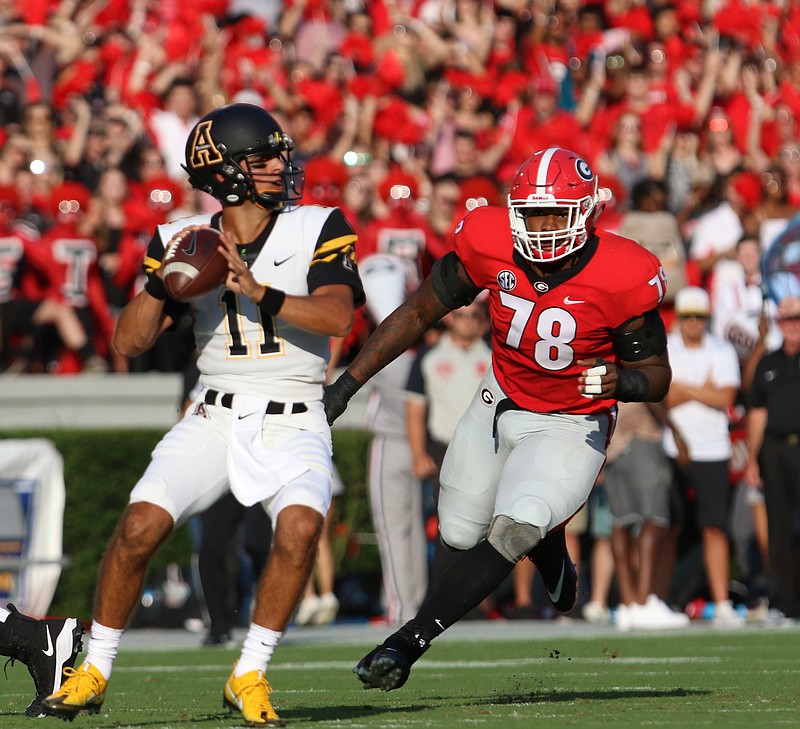 Georgia defensive tackle Trenton Thompson pressures Appalachian State quarterback Taylor Lamb during Saturday night's 31-10 win by the Bulldogs.