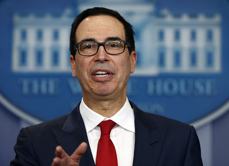 
              FILE - In this Friday, Aug. 25, 2017, file photo, Treasury Secretary Steven Mnuchin speaks during a news briefing at the White House in Washington. Mnuchin is calling on Congress to combine a $7.9 billion disaster relief package for Hurricane Harvey with a contentious increase in the nation's debt limit. He says it’s time to "put politics aside" so storm victims can get the help they need.” Trump plans to meet with congressional leaders from both parties this week. (AP Photo/Carolyn Kaster, File)
            