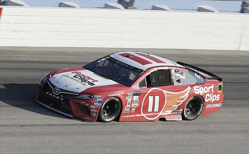 Denny Hamlin drives in Turn 1 during a NASCAR Monster Cup auto race at Darlington Raceway, Sunday, Sept. 3, 2017, in Darlington, S.C. (AP Photo/Terry Renna)