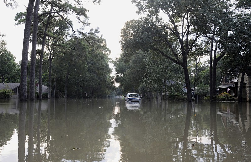 
              A pickup truck gets stranded on a street in a flooded neighborhood west of downtown Houston on Sunday, Sept. 3, 2017. The city has ordered a mandatory evacuation of flooded-out homes in the area, but people are still retrieving belongings from homes that have been standing in water for days. (AP Photo/Jay Reeves)
            