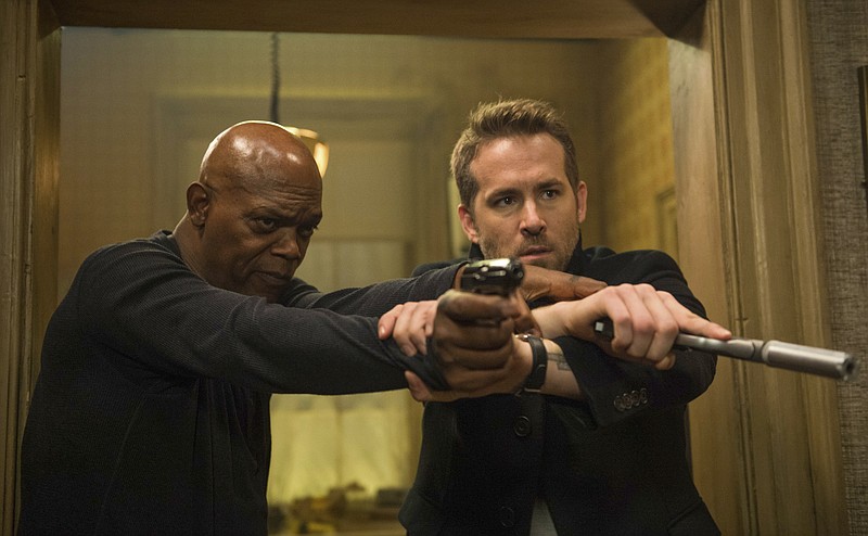 
              This image released by Lionsgate shows Samuel L. Jackson, left, and Ryan Reynolds in "The Hitman's Bodyguard." (Jack English/Lionsgate via AP)
            