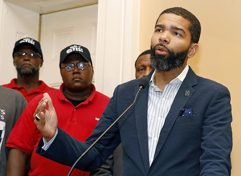 
              In this July 31, 2017 photo, Jackson, Miss., Mayor Chokwe Antar Lumumba expresses his support for a intimidation free union election during a Jackson, Miss., news conference, Monday, July 31, 2017.  Lumumba won in Jackson, Mississippi, promising to make the city “the most radical ... on the planet.”  (AP Photo/Rogelio V. Solis)
            