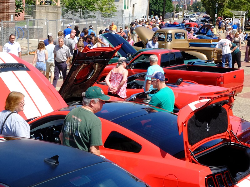 Hundreds of onlookers check out the Hot Rod and Auto Show Sunday, Sept. 3, 2017, outside the Chattanooga Market.