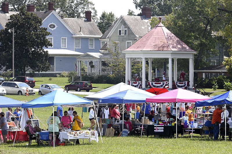 Vendors's tents dot the polo ground while the historic officers's quarters stand in the background at the 6th Cavalry Museum's Labor Day at the Post in Fort Oglethorpe on Sept. 4, 2017.