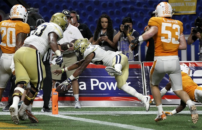 Georgia Tech quarterback TaQuon Marshall (16) dives for a touchdown against Tennessee during the Chick-fil-A Kickoff Game at Mercedes-Benz Stadium on Monday, Sept. 4, in Atlanta, Ga.