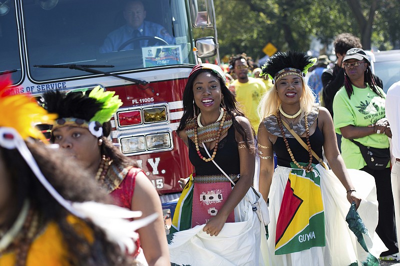 
              Dancers arrive in costume at the West Indian Day Parade on Monday, Sept. 4, 2017, in the Brooklyn borough of New York. The parade, one of the largest celebrations of Caribbean culture in the U.S., is being held amid ramped-up security. (AP Photo/Kevin Hagen)
            