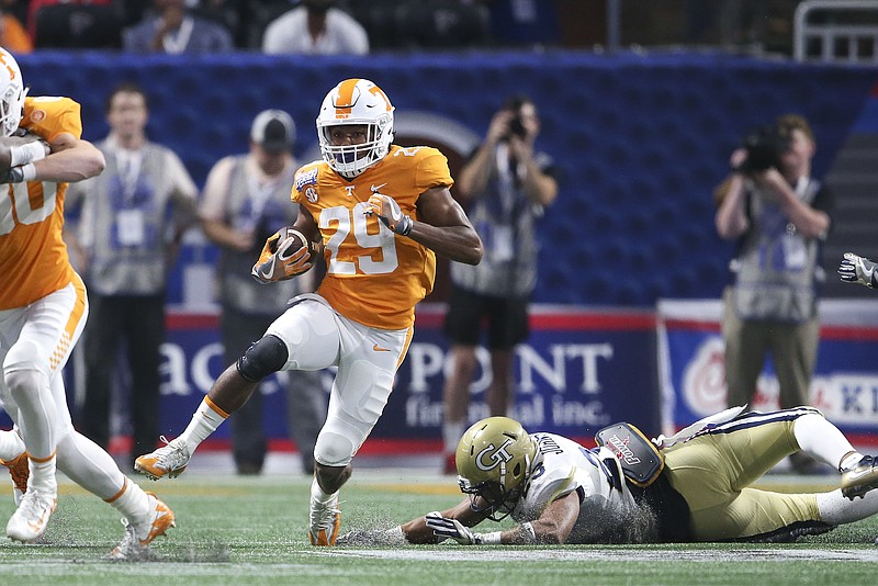 Tennessee's Evan Berry (29) runs past Georgia Tech's Jalen Johnson (23) as he returns the opening kickoff in the first half of an NCAA college football game Monday, Sept. 4, 2017, in Atlanta. (AP Photo/John Bazemore)