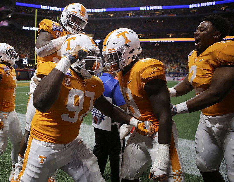 Tennessee defensive lineman Paul Bain (97) celebrates after he blocked a Georgia Tech field goal attempt to send the game into overtime during the Chick-fil-A Kickoff Game at Mercedes-Benz Stadium on Monday, Sept. 4, in Atlanta, Ga.