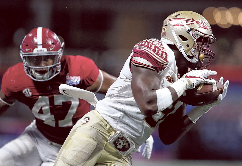 Florida State running back Jacques Patrick (9) makes the catch against Alabama linebacker Christian Miller (47) during the second half of an NCAA football game, Saturday, Sept. 2, 2017, in Atlanta. (AP Photo/John Bazemore)