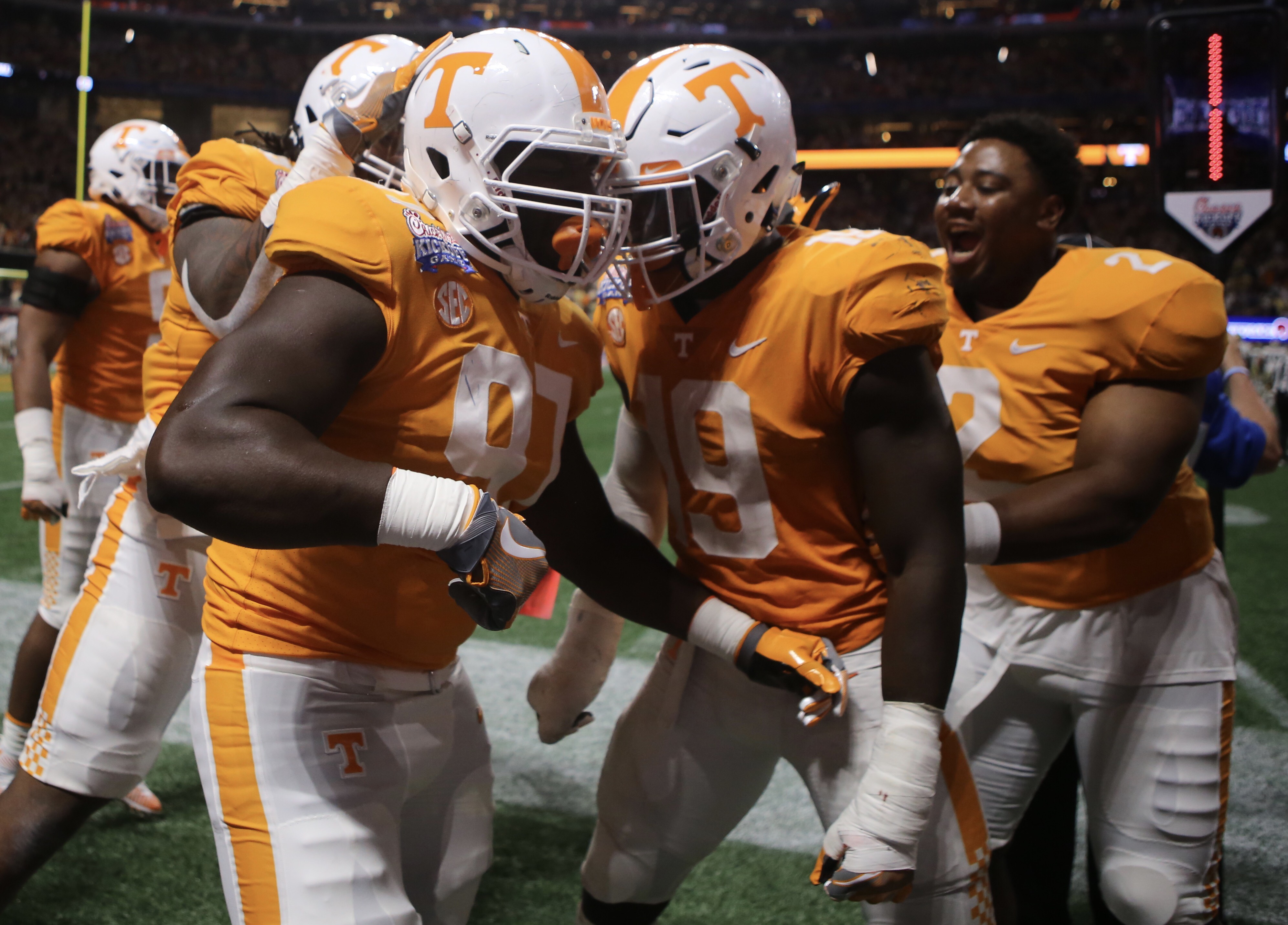 Tennessee defensive lineman Paul Bain, left, celebrates with teammates after he blocked a field goal to send Monday night's game against Georgia Tech to overtime. The Vols won 42-41 in double overtime at Mercedes-Benz Field in Atlanta.