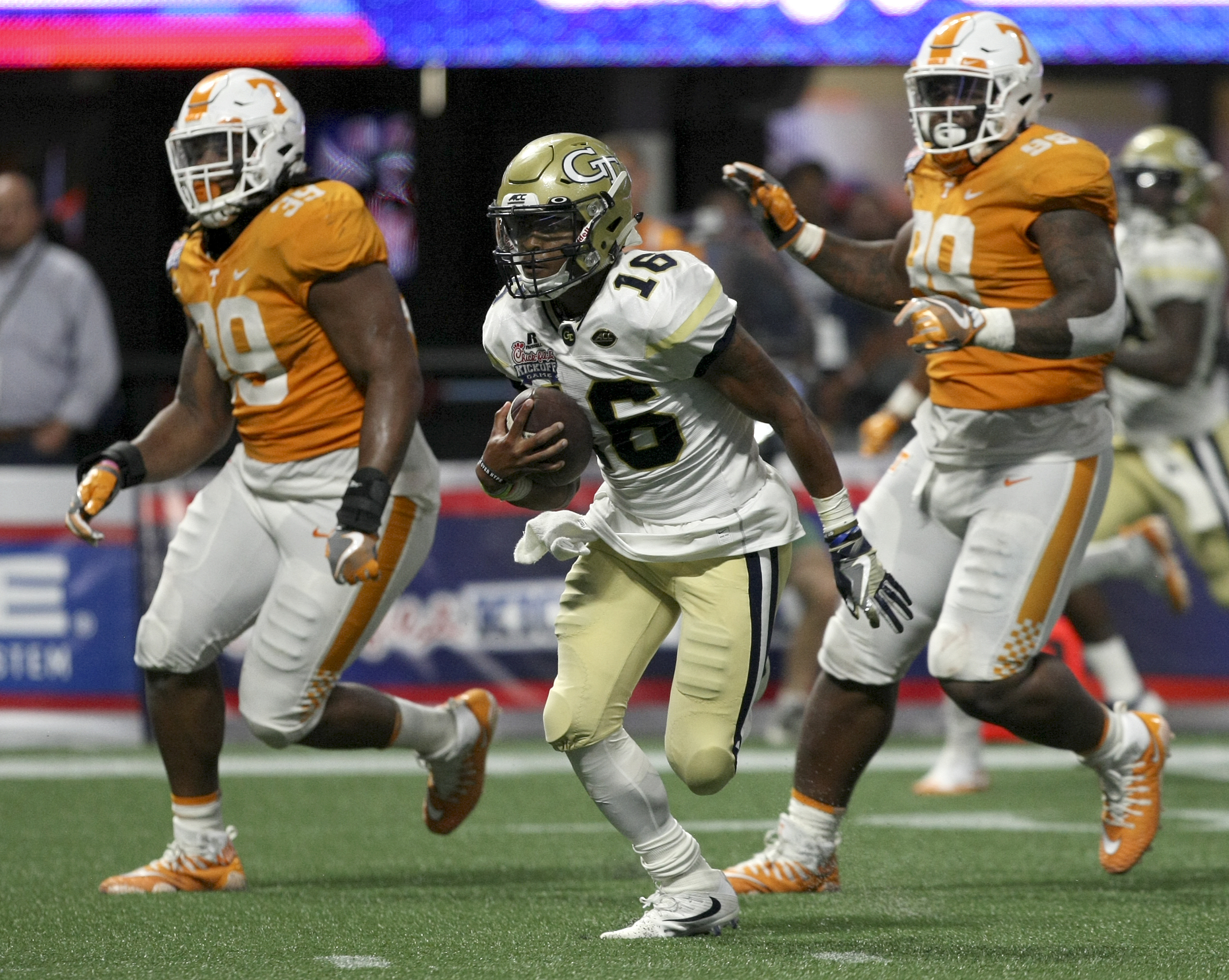 Georgia Tech quarterback TaQuon Marshall (16) carries the ball against Tennessee during the Chick-fil-A Kickoff Game at Mercedes-Benz Stadium on Monday, Sept. 4, in Atlanta, Ga.