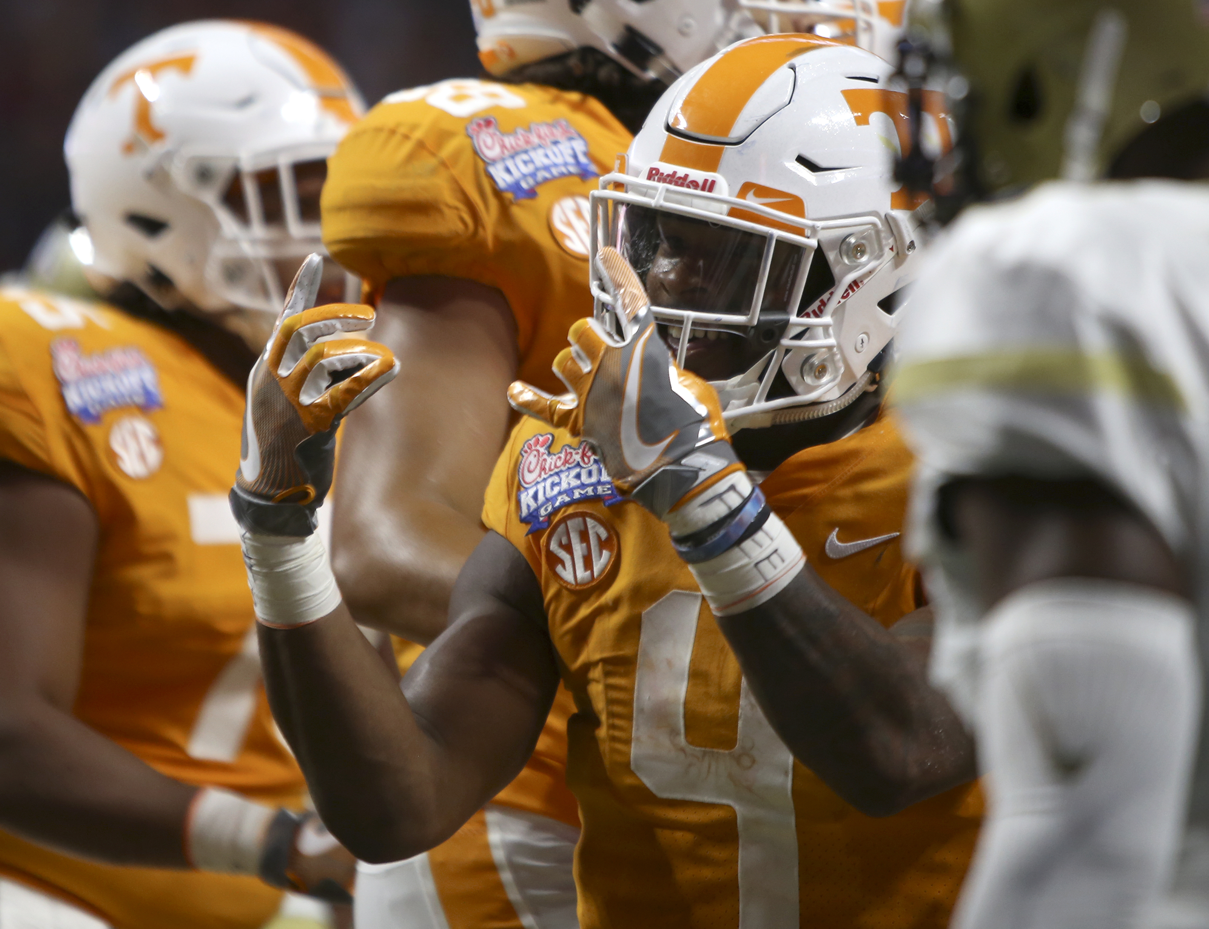Tennessee running back John Kelly (4) celebrate his touchdown run against Georgia Tech during the Chick-fil-A Kickoff Game at Mercedes-Benz Stadium on Monday, Sept. 4, in Atlanta, Ga.