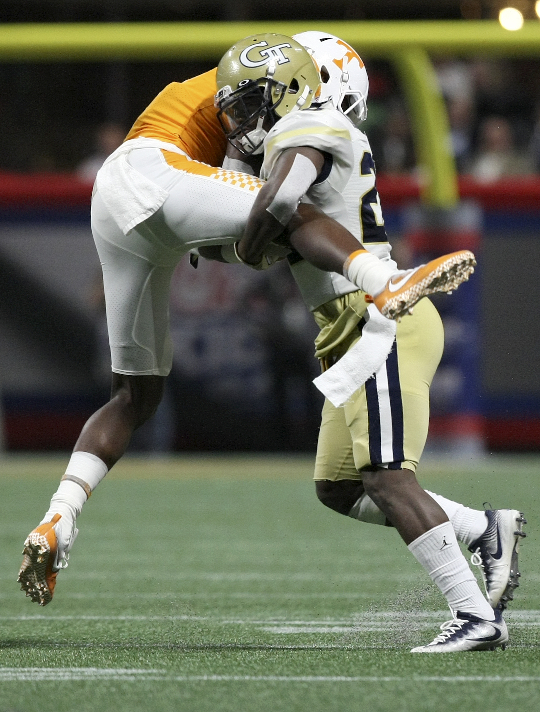 Georgia Tech defensive back Lawrence Austin (20) tackles Tennessee wide receiver Josh Palmer (5) during the Chick-fil-A Kickoff Game at Mercedes-Benz Stadium on Monday, Sept. 4, in Atlanta, Ga.