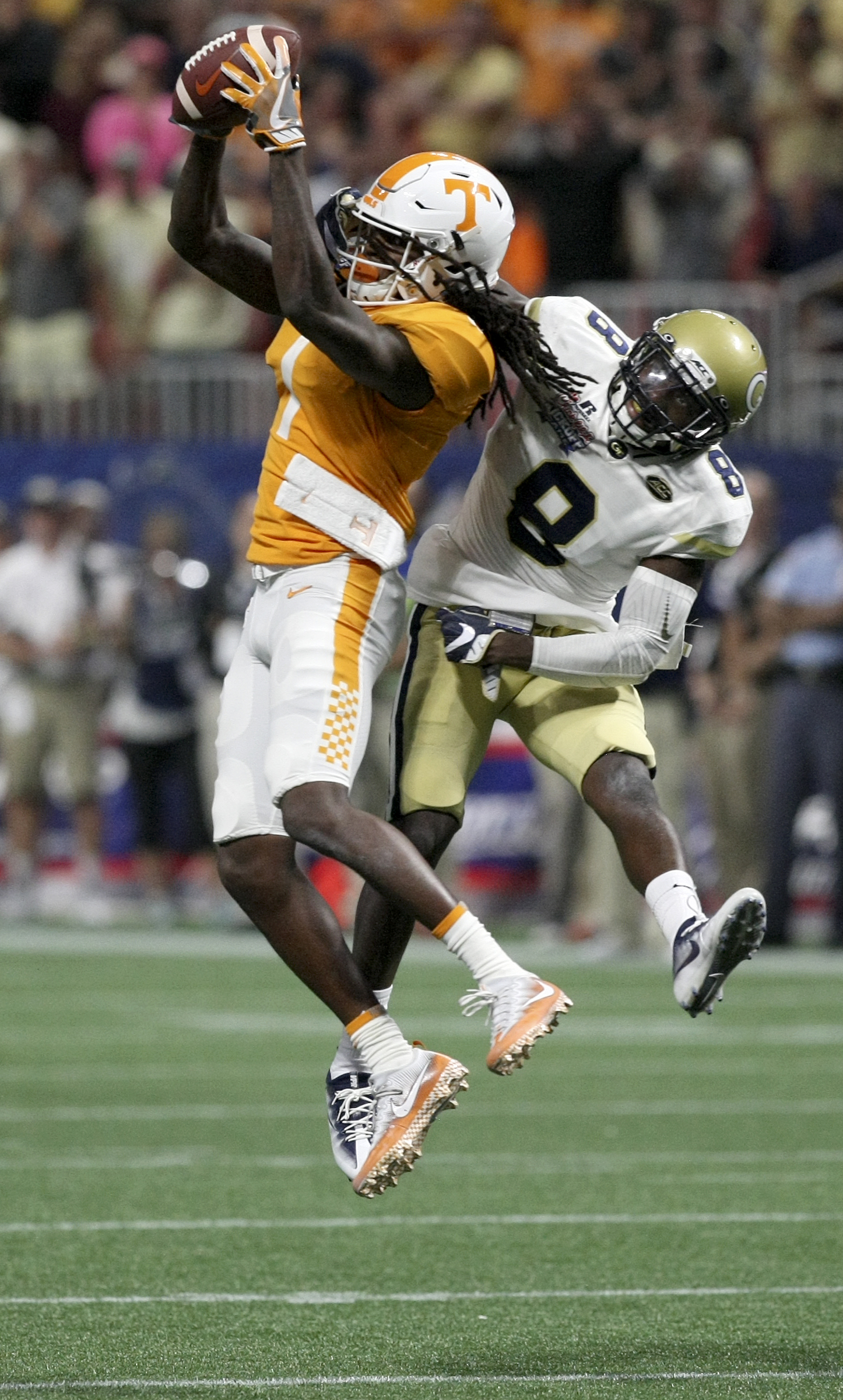 Tennessee wide receiver Marquez Callaway (1) pulls in a catch against Georgia Tech defensive back Step Durham (8) during the Chick-fil-A Kickoff Game at Mercedes-Benz Stadium on Monday, Sept. 4, in Atlanta, Ga.