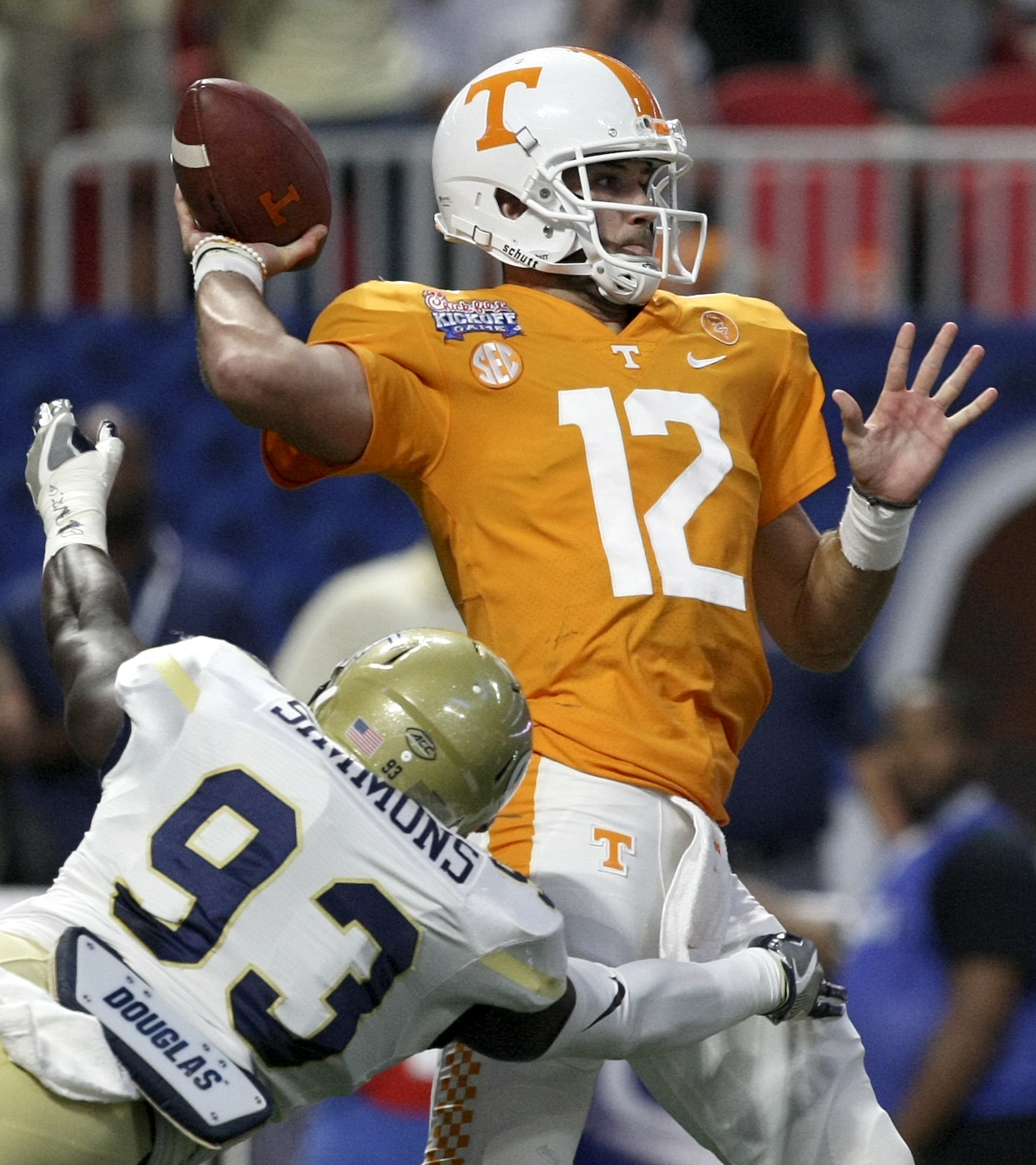 Tennessee quarterback Quinten Dormady (12) throws under pressure from Georgia Tech defensive lineman Antonio Simmons (93) during the Chick-fil-A Kickoff Game at Mercedes-Benz Stadium on Monday, Sept. 4, in Atlanta, Ga.