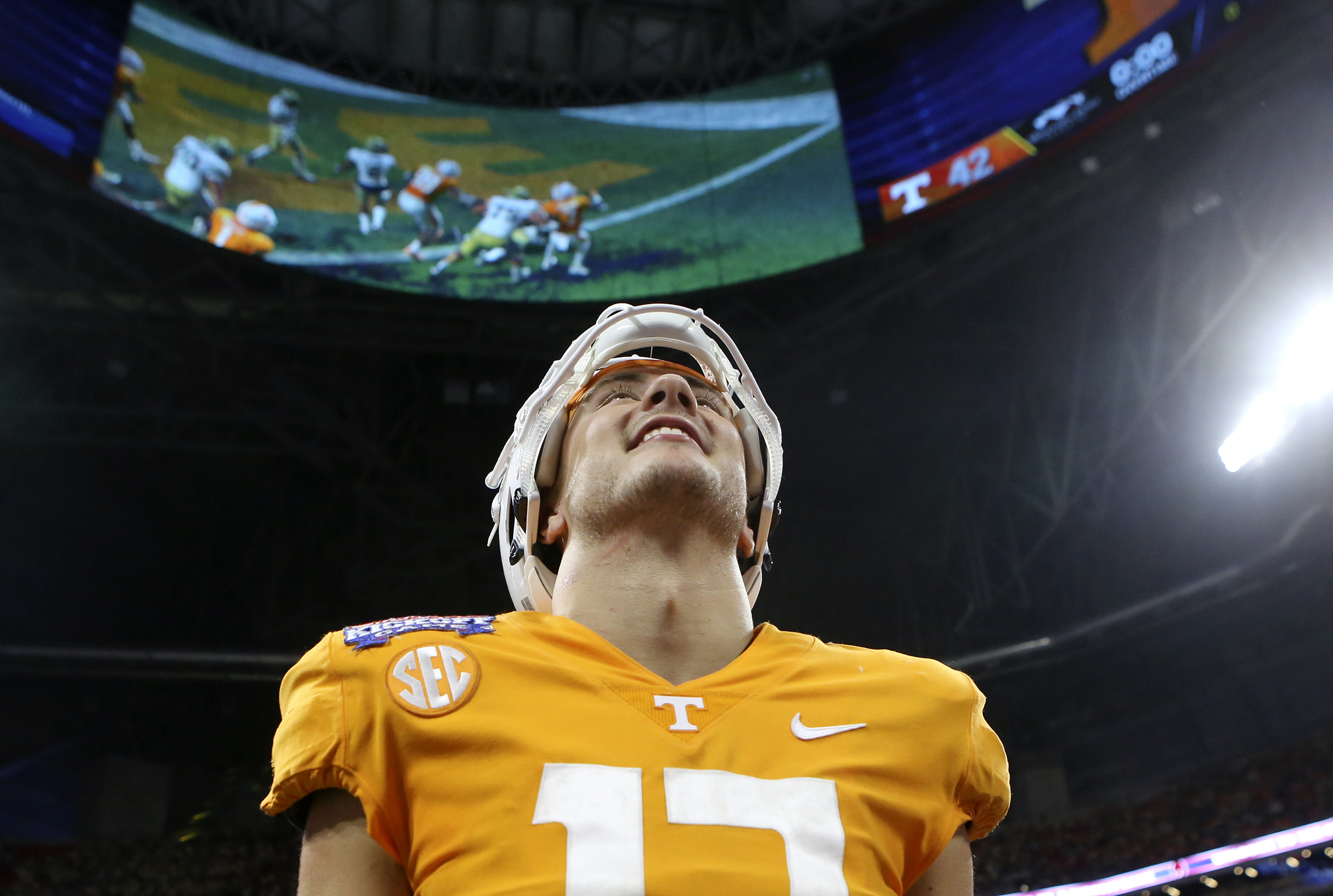 Tennessee linebacker Dillon Bates (17) watches a replay on the halo board after their double-overtime victory over Georgia Tech in the Chick-fil-A Kickoff Game at Mercedes-Benz Stadium on Monday, Sept. 4, in Atlanta, Ga.
