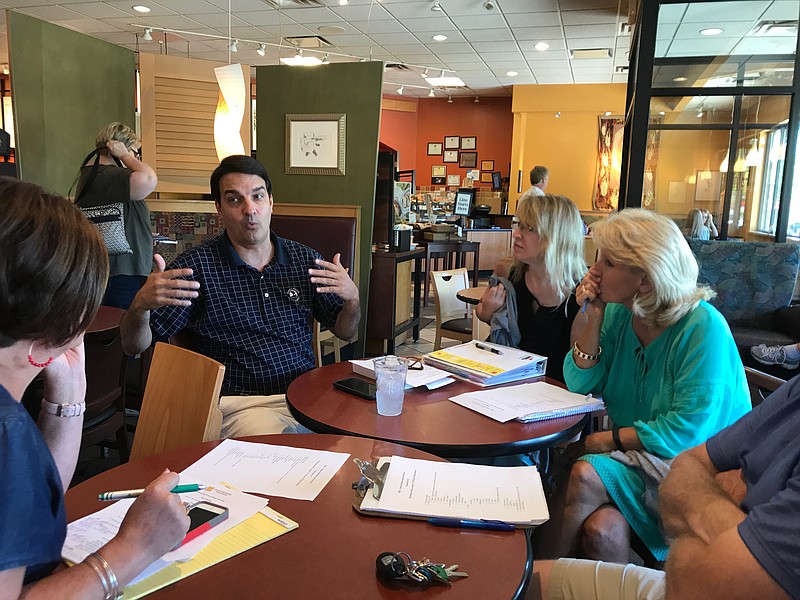 During a planning session for the Hixson Alumni Association's upcoming reunion, committee member Greg Martin, second from left, addresses the rest of the committee: Gina McClure (chairwoman), David Gray, Becky Kirk, Chris Brown, Carmen Peace and Terri Braswell Gilbert.