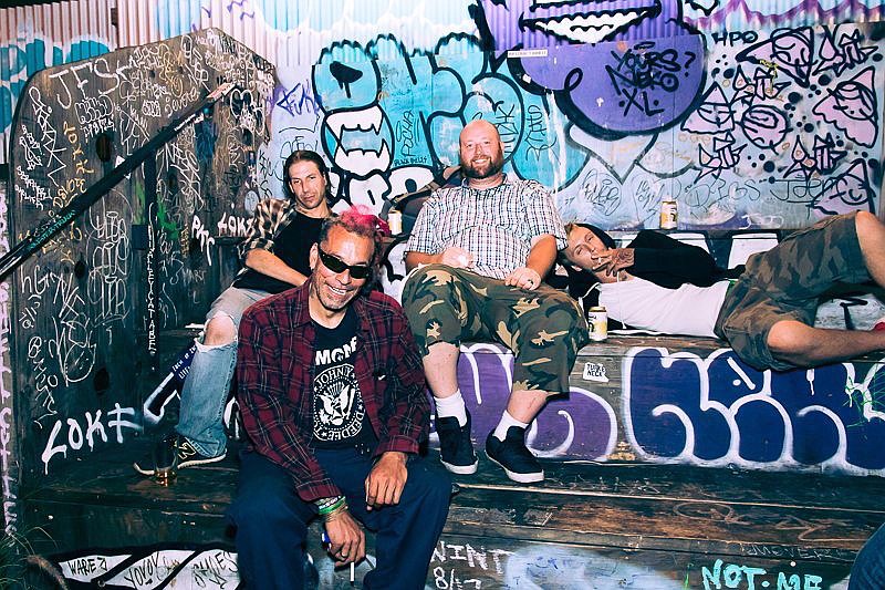 Chuck Mosley, foreground, former singer for Faith No More, plays essentially an acoustic set with two guitars, a conga and his vocals at JJ's Bohemia on Friday.