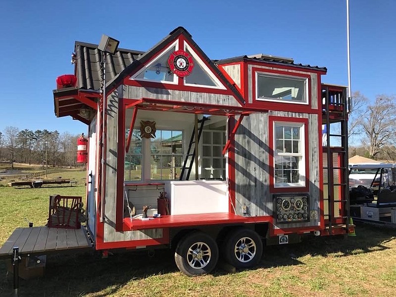 John and Fin Kernohan, organizers of the Tennessee Tiny House Festival, travel the U.S. in their 148-square-foot "Tiny Firehouse - Station No. 9," which is a tribute to firefighters and is used to promote fire prevention awareness.