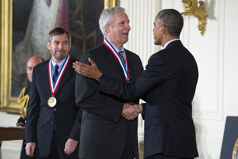 
              FILE - In this Thursday, Nov. 20, 2014, file photo, Douglas Lowy, left, and John Schiller, of the National Cancer Institute, National Institutes of Health are awarded the National Medal of Technology and Innovation by President Barack Obama, during a ceremony in the East Room of the White House in Washington. The Albert and Mary Lasker Foundation announced Wednesday, Sept. 6, 2017, that it awarded Lowy and Schiller of the U.S. National Cancer Institute its clinical research award. The public service award went to Planned Parenthood and the basic research prize went to Michael N. Hall of the Biozentrum Institute at the University of Basel. (AP Photo/Evan Vucci, File)
            