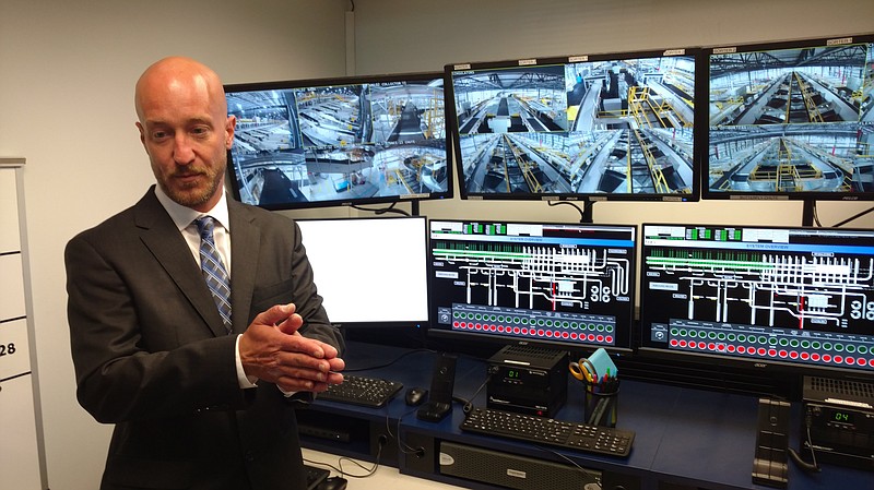 Travis Asberry, senior manager of FedEx Ground's new distribution center at Interstate 75 and Apison Pike, shows off the facility's high-tech control center.
