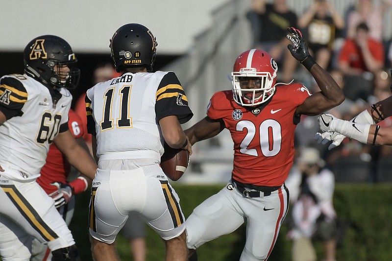Georgia defensive back J.R. Reed closes in on Appalachian State quarterback Taylor Lamb during last Saturday's 31-10 win by the Bulldogs.